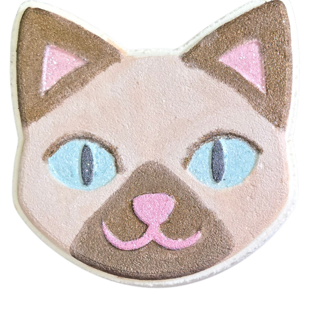 Kitty bath bomb painted with Siamese kitty colors, tan and brown points, with blue eyes 