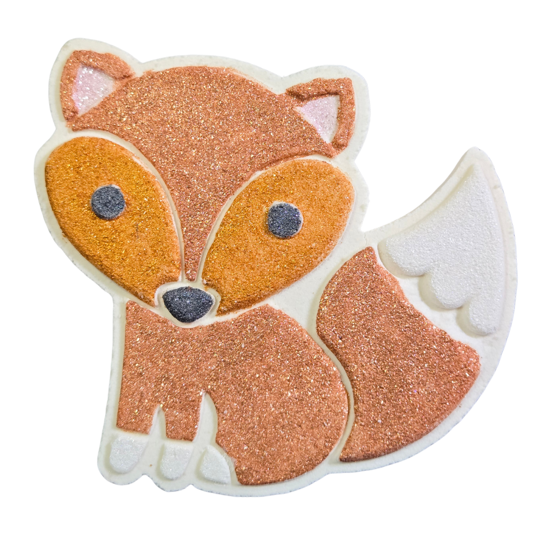Fox shaped bath bomb painted in copper, gold, white feet and tip of tail, black nose and eyes